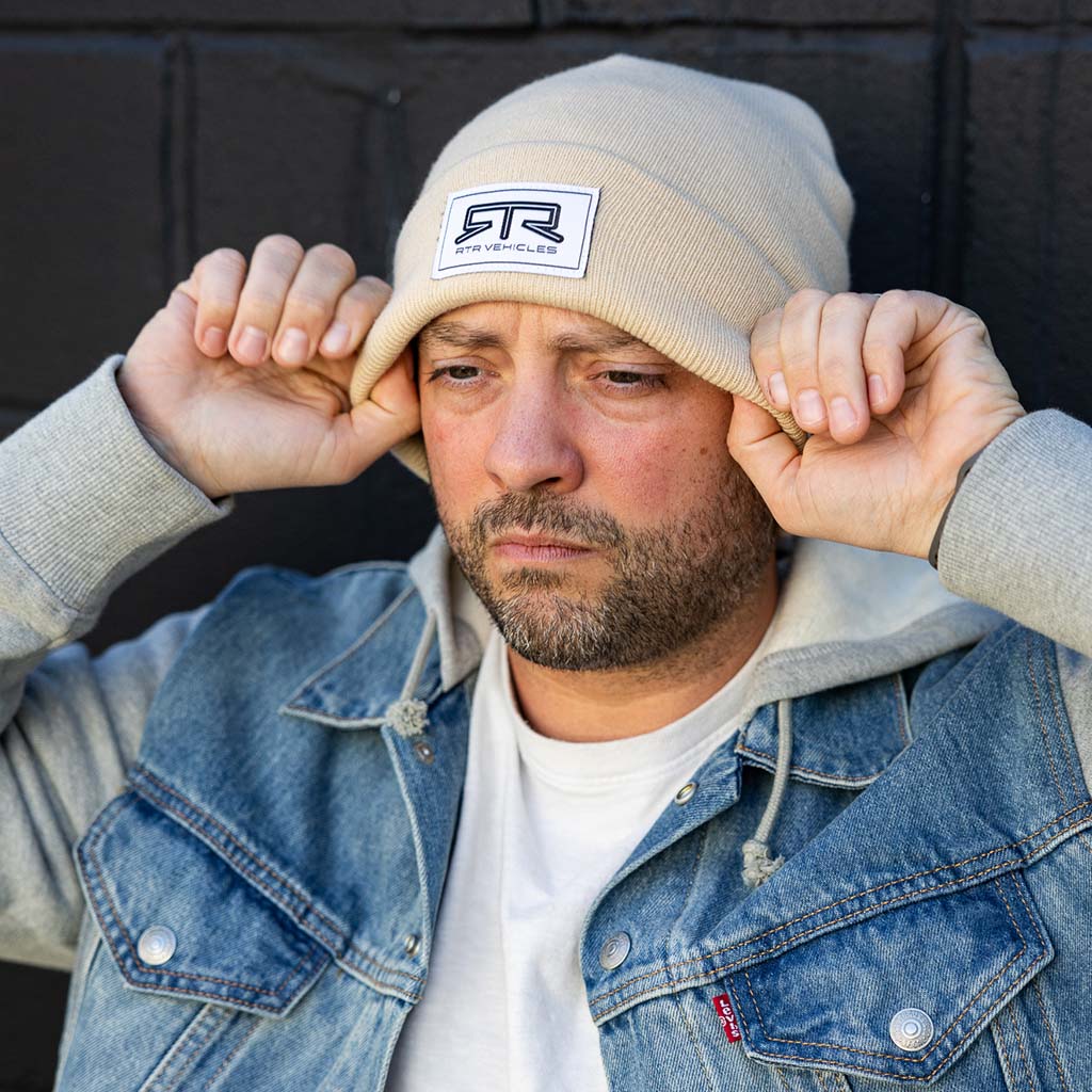 Man wearing the RTR Beanie, showcasing its snug fit and stitched RTR logo tag, embodying comfort and the RTR lifestyle.