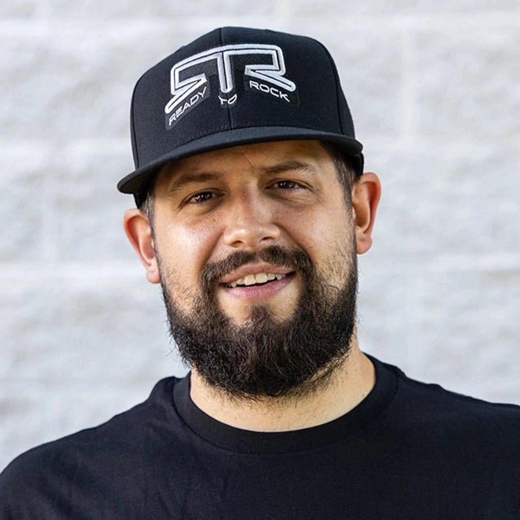 Front view of a man wearing the RTR Core Flexfit Hat.