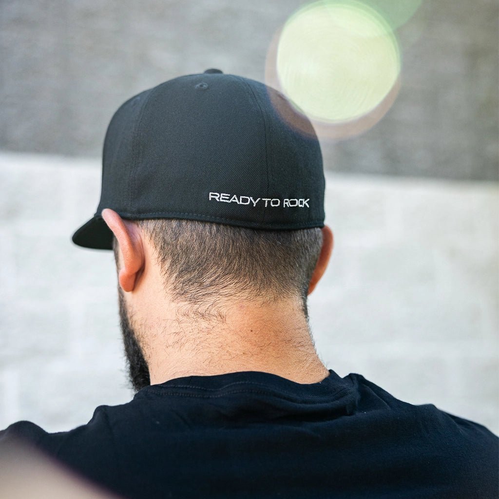Man wearing the RTR Core Flexfit Hat with "Ready To Rock" embroidered in White.