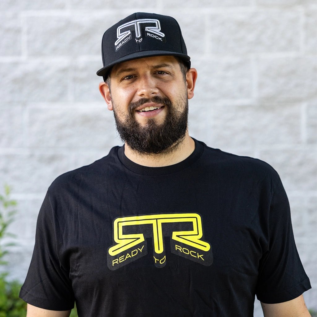 Front view of a man wearing the RTR Core Flexfit Hat.