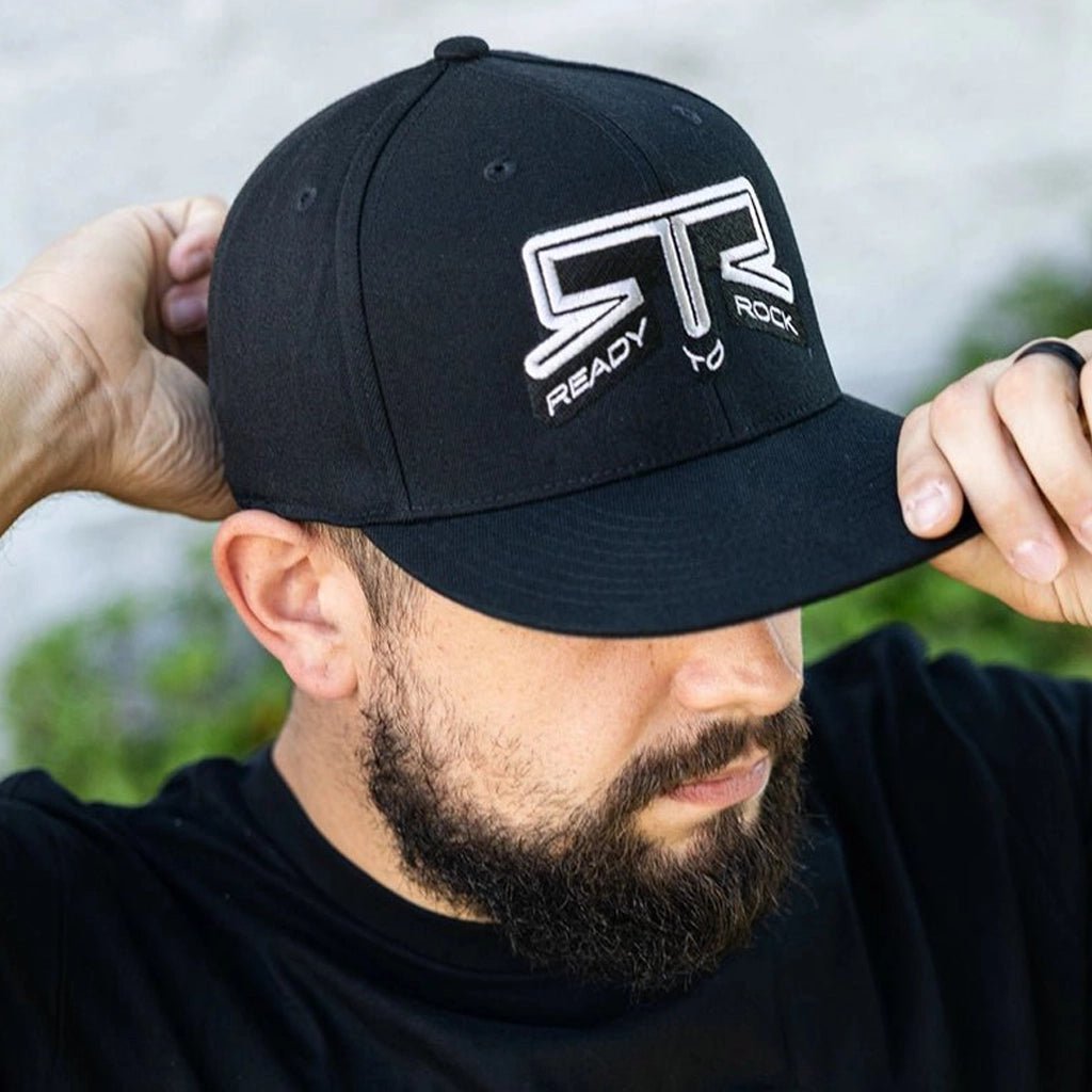 Front three quarter view of a man wearing the RTR Core Flexfit Hat.