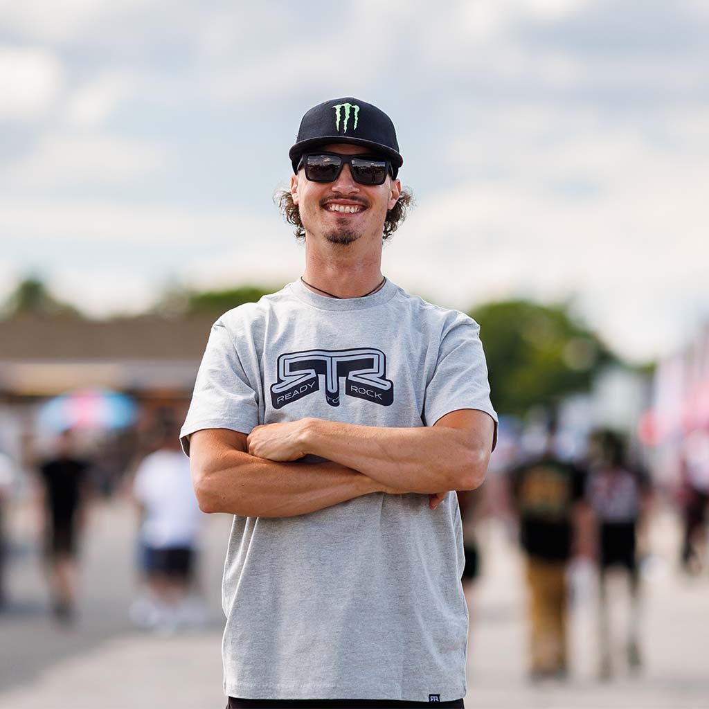 Ben Hobson wearing an Athletic Heather RTR Core T-Shirt outdoors.