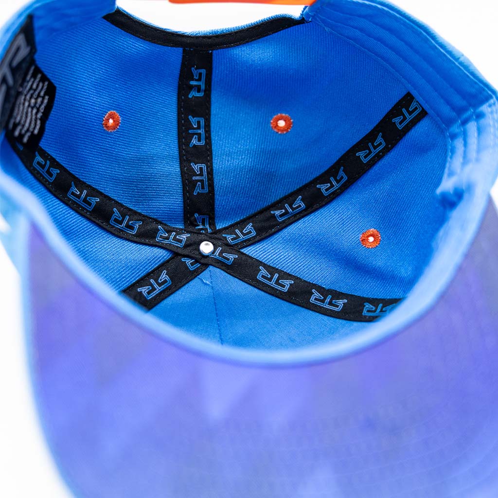 RTR Drift Team Snapback featuring black and orange stripes, driver-specific monograms, and speedblock embroidery, designed for motorsports fans with a structured crown and flat brim.