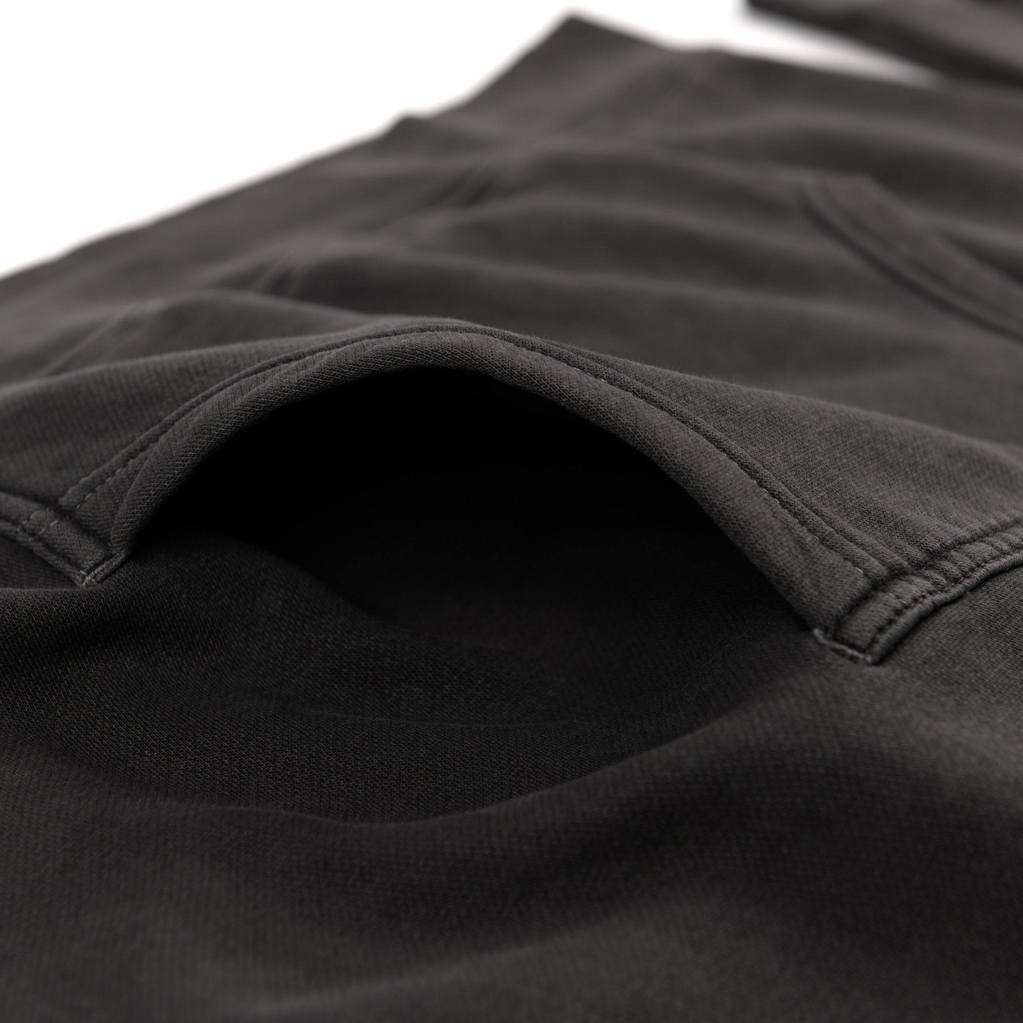 RTR Tonal Logo Hoodie pocket, showcasing its unique texture and pigment wash