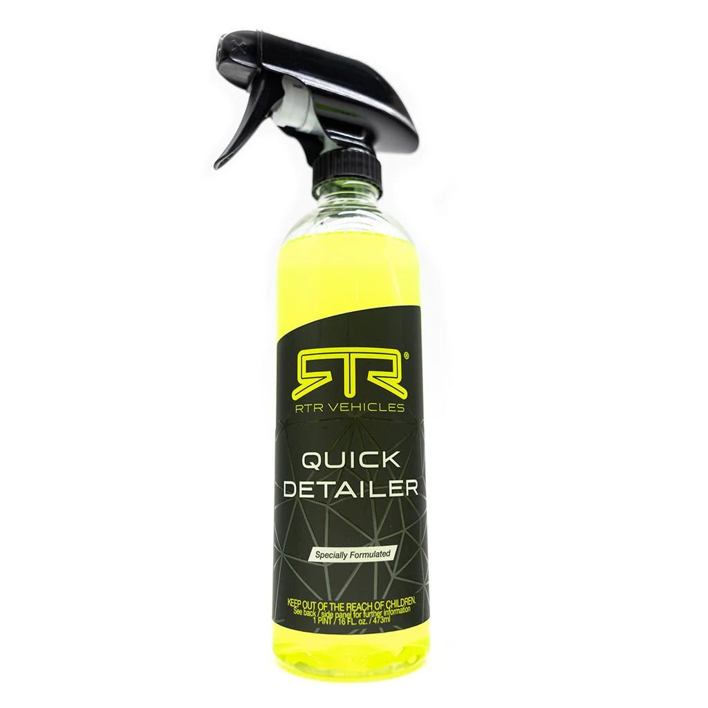 A spray bottle with yellow Quick Detailer for vehicle detailing. Made in the USA.