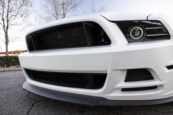 Front view of RTR Upper and Lower Grille for 13-14 Mustang GT, V6. Aggressive design inspired by the Mustang RTR, enhancing airflow and cooling. Easy installation with durable TPO construction.