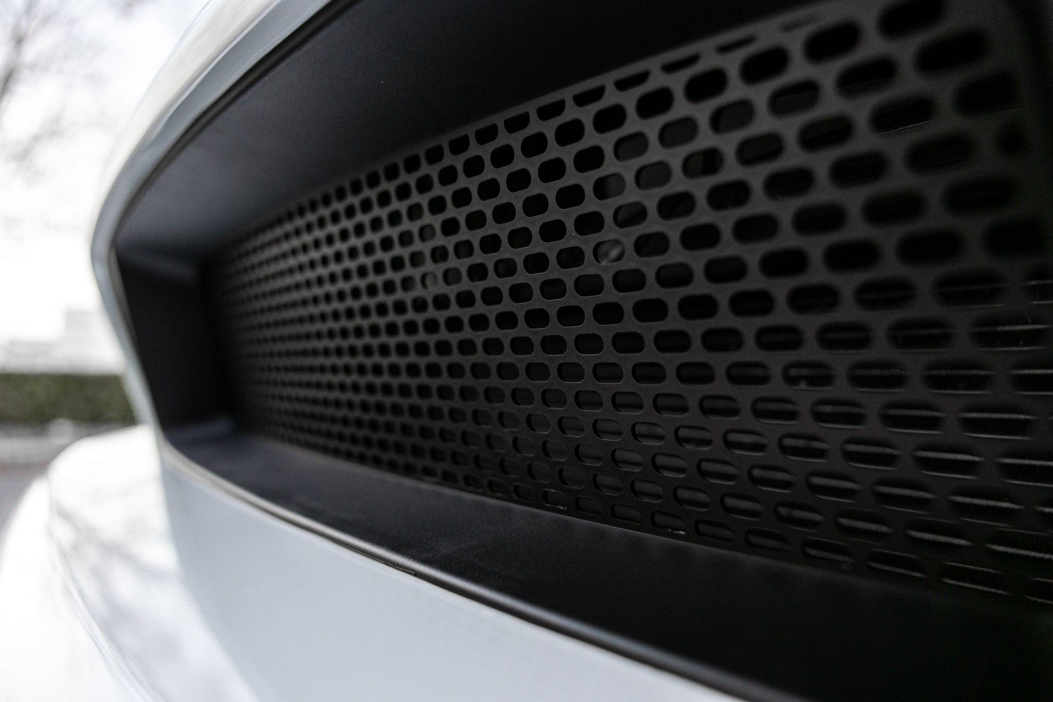 Close-up of black RTR Upper and Lower Grille for 13-14 Mustang GT/V6, featuring modern aggressive styling with pill patterned vents for increased airflow and performance.